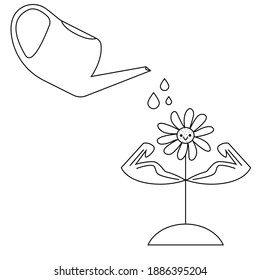 

watering can and flower. fertilization and watering for the growth of flowers.