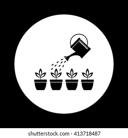 Watering can with plants 