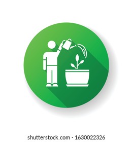 Watering sapling green flat design long shadow glyph icon. Houseplant caring. Plant growing. Indoor gardening. Moisturizing, rehydrating soil. Moistening plants. Silhouette RGB color illustration