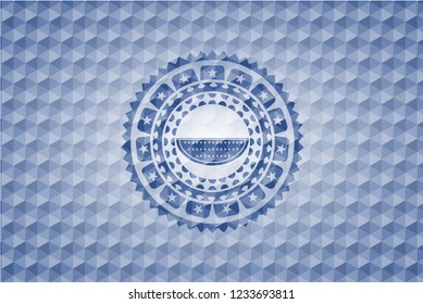 watermelon icon inside blue emblem or badge with abstract geometric polygonal pattern background.