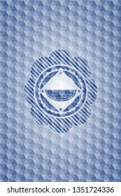 watermelon icon inside blue emblem with geometric background.