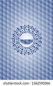 watermelon icon inside blue emblem or badge with abstract geometric polygonal pattern background.