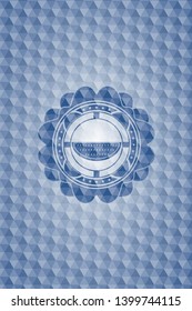 watermelon icon inside blue emblem or badge with abstract geometric pattern background.
