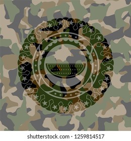 watermelon icon inside camouflaged emblem
