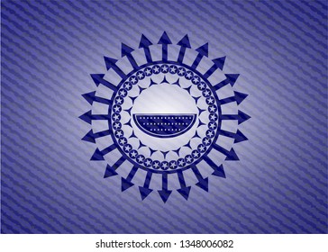 watermelon icon inside emblem with denim texture