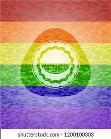 watermelon icon inside emblem on mosaic background with the colors of the LGBT flag