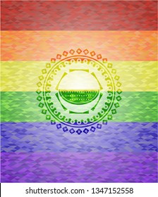 watermelon icon inside emblem on mosaic background with the colors of the LGBT flag