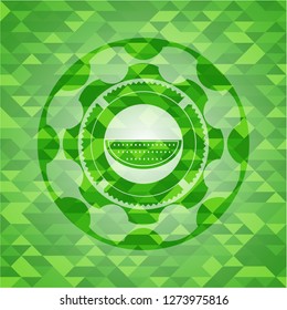 watermelon icon inside green mosaic emblem