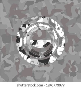 watermelon icon inside grey camouflage texture