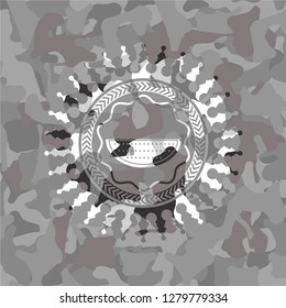 watermelon icon inside grey camouflage texture
