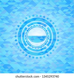 watermelon icon inside light blue mosaic emblem