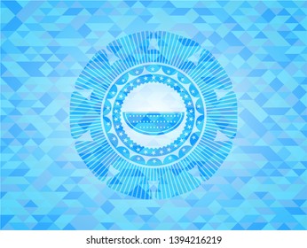 watermelon icon inside light blue emblem with mosaic background