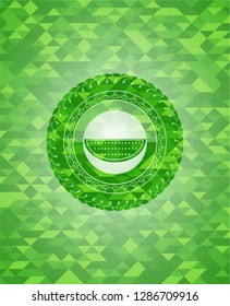 watermelon icon inside realistic green emblem. Mosaic background