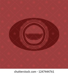 watermelon icon inside red emblem