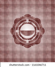 watermelon icon inside red seamless badge with geometric pattern background.
