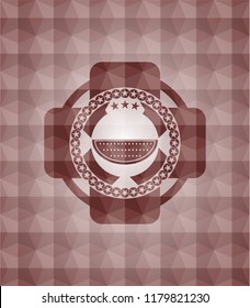 watermelon icon inside red seamless emblem with geometric background.