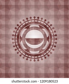 watermelon icon inside red seamless emblem with geometric background.