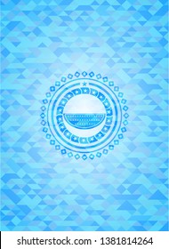 watermelon icon inside sky blue emblem. Mosaic background