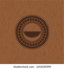 watermelon icon inside wooden emblem. Vintage.