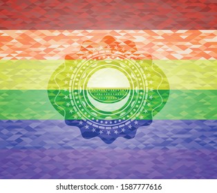 watermelon icon on mosaic background with the colors of the LGBT flag