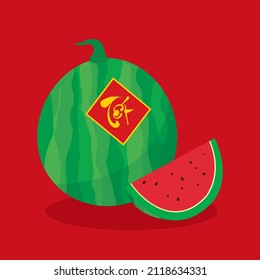 Watermelon whole and sliced with Lunar New Year Vietnamese decoration. Text translation: "New Year".