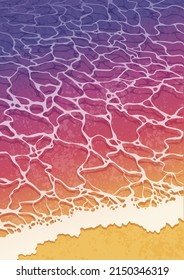 Wave lapping on a sandy beach. Sunset.