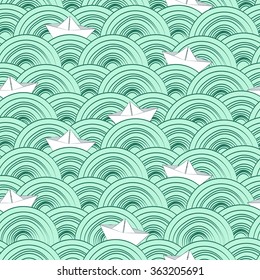 Waves doodle background with paper ships. Sea seamless pattern
