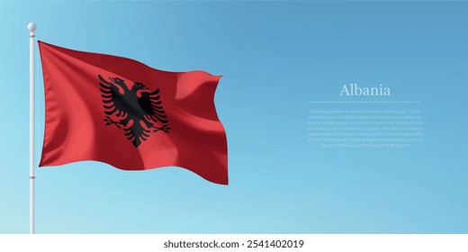 Waving flag of Albania on a pole with a blue sky backdrop with copyspace