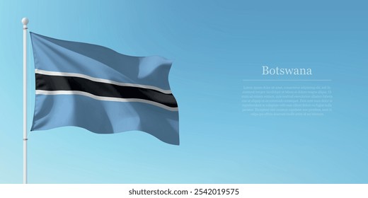 Waving flag of Botswana on a pole with a blue sky backdrop with copyspace