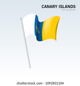Waving flag of Canary Islands the autonomous communities of Spain on gray background