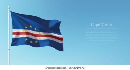 Waving flag of Cape Verde on a pole with a blue sky backdrop with copyspace