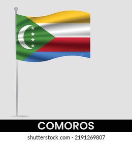 Bandera ondeando las Comoras en el asta de bandera. Plantilla para diseño de afiches del día de la independencia
