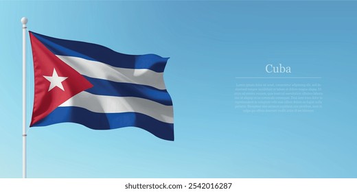 Waving flag of Cuba on a pole with a blue sky backdrop with copyspace