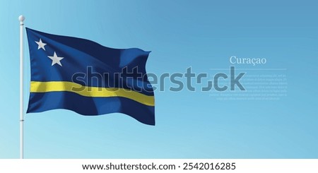 Waving flag of Curacao on a pole with a blue sky backdrop with copyspace