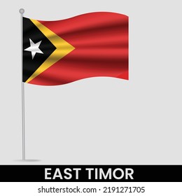 Waving flag of East Timor on flagpole. Template for independence day poster design

