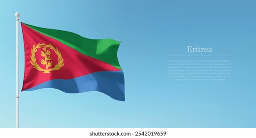 Waving flag of Eritrea on a pole with a blue sky backdrop with copyspace