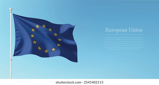 Waving flag of European Union on a pole with a blue sky backdrop with copyspace