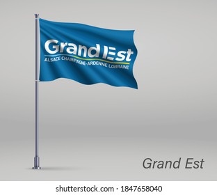 Waving flag of Grand Est - region of France on flagpole. Template for independence day