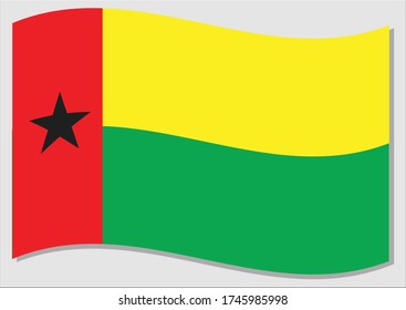 Waving flag of Guinea Bissau vector graphic. Waving Guinean flag illustration. Guinea Bissau country flag wavin in the wind is a symbol of freedom and independence.