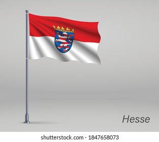 Waving flag of Hesse - state of Germany on flagpole. Template for independence day 