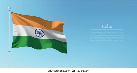 Waving flag of India on a pole with a blue sky backdrop with copyspace