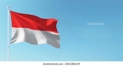 Waving flag of Indonesia on a pole with a blue sky backdrop with copyspace