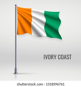 Waving flag of Ivory Coast on flagpole. Template for independence day poster design