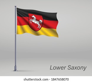 Waving flag of Lower Saxony - state of Germany on flagpole. Template for independence day 