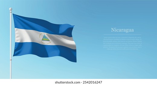 Waving flag of Nicaragua on a pole with a blue sky backdrop with copyspace