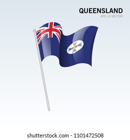 Waving flag of Queensland states,territories of Australia on gray background