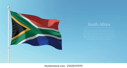 Waving flag of South Africa on a pole with a blue sky backdrop with copyspace