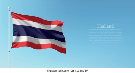 Waving flag of Thailand on a pole with a blue sky backdrop with copyspace