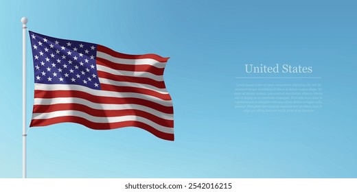 Waving flag of United States on a pole with a blue sky backdrop with copyspace