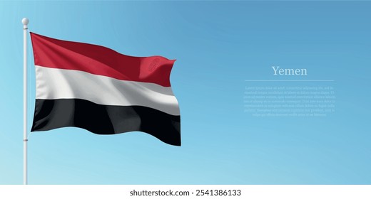 Waving flag of Yemen on a pole with a blue sky backdrop with copyspace